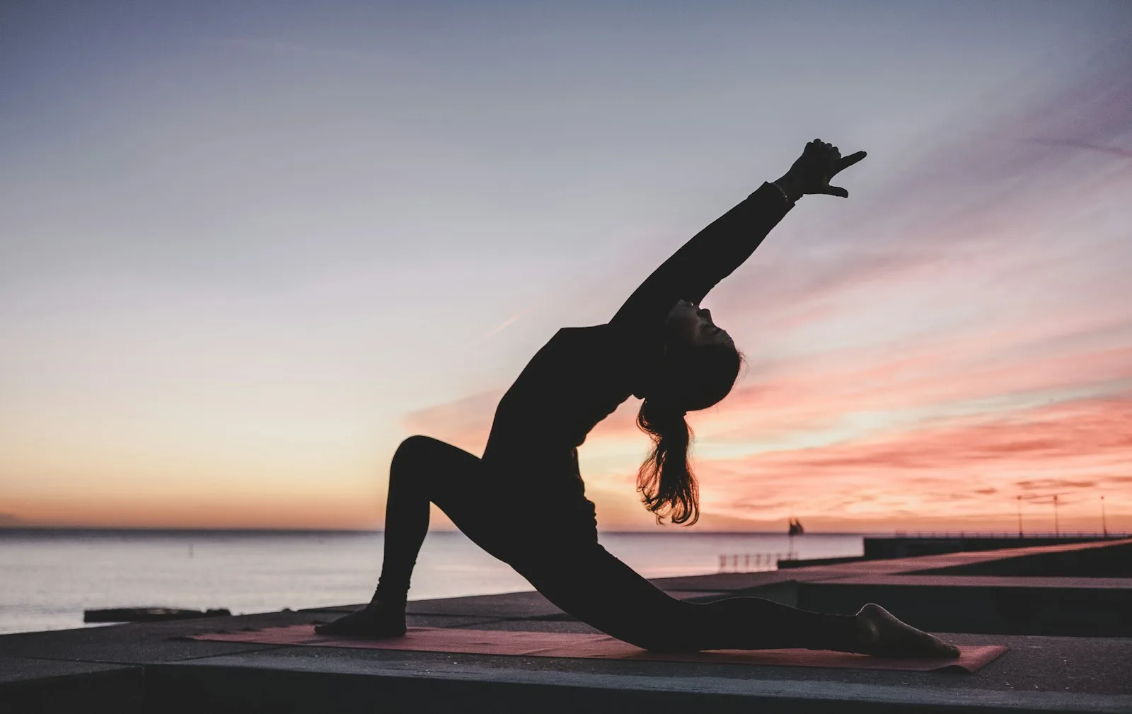 Person in a calm yoga pose on a mat